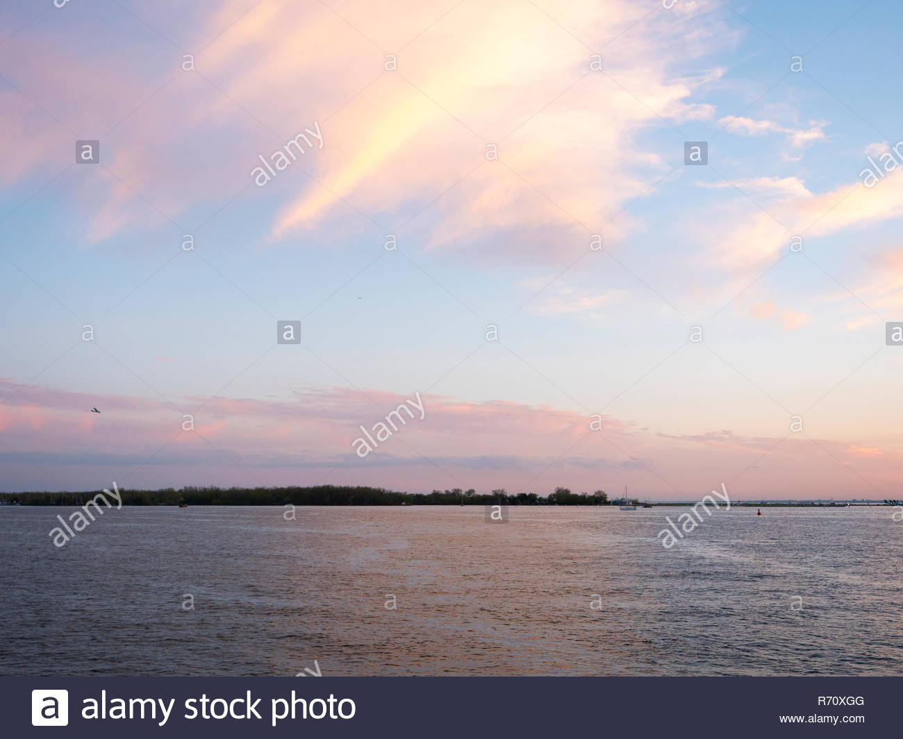 Vibrant sunset colors reflecting over Lake Ontario
