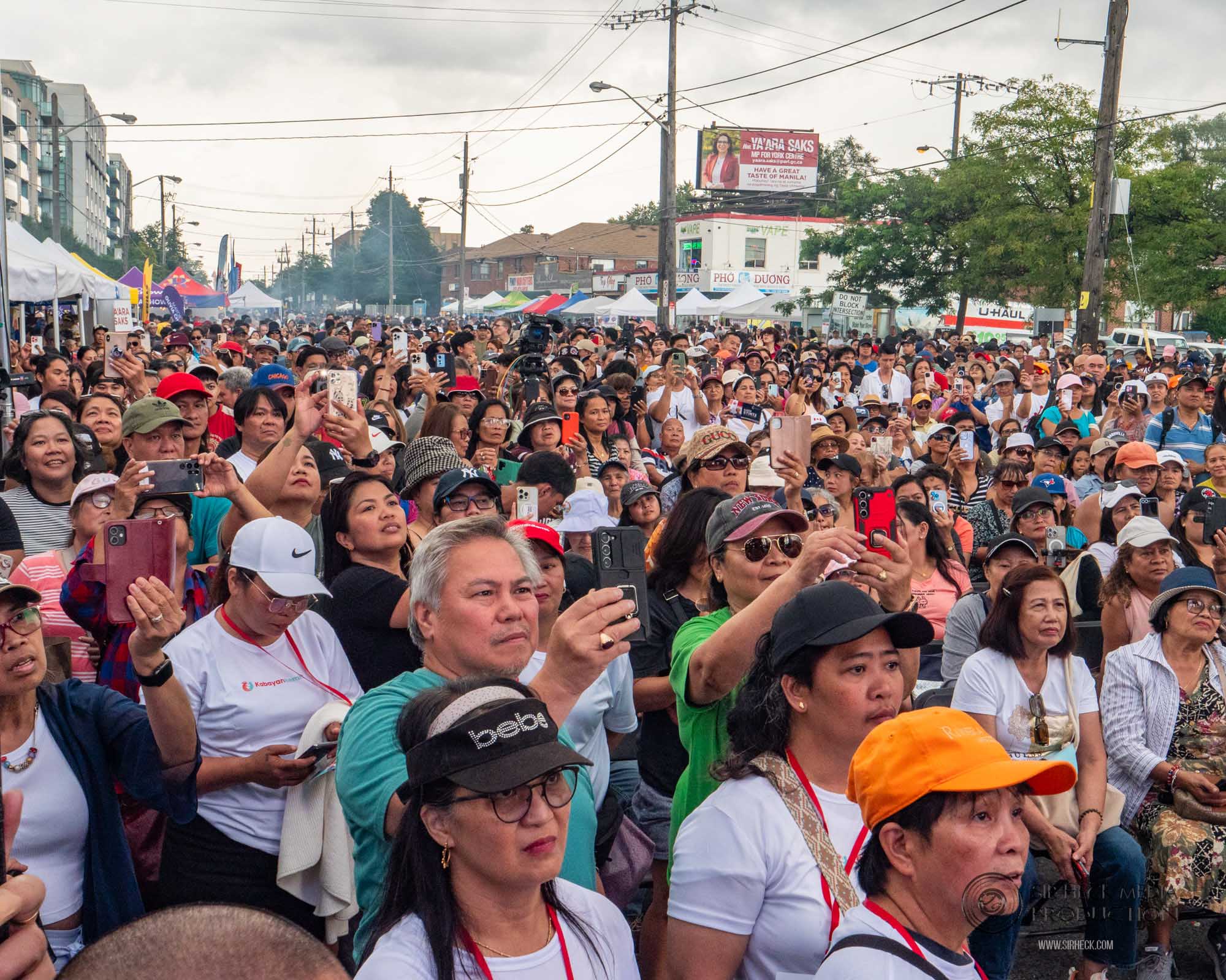 Festival opening gates and early attendees on Bathurst Street