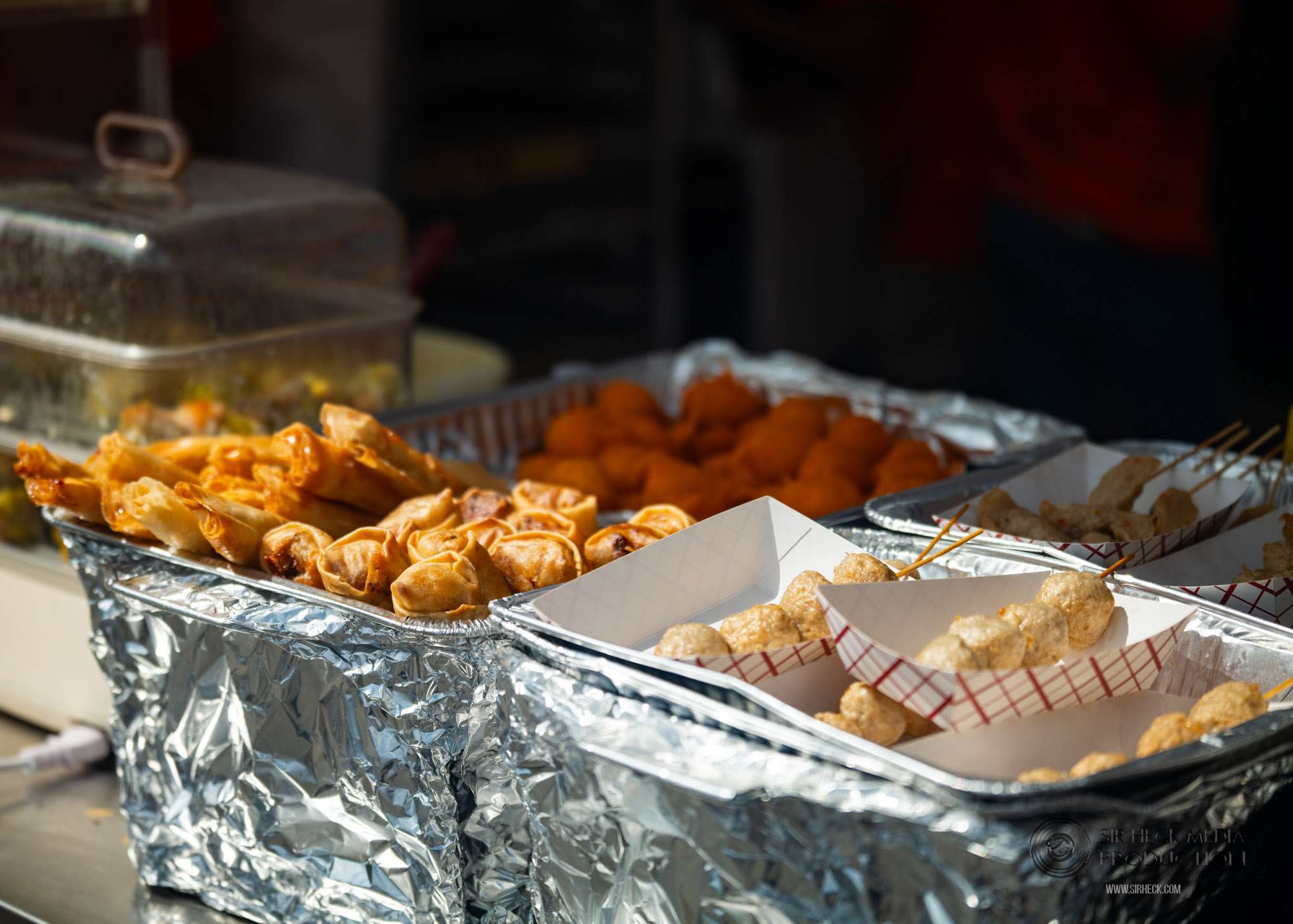 Artisan food preparation at vendor stall
