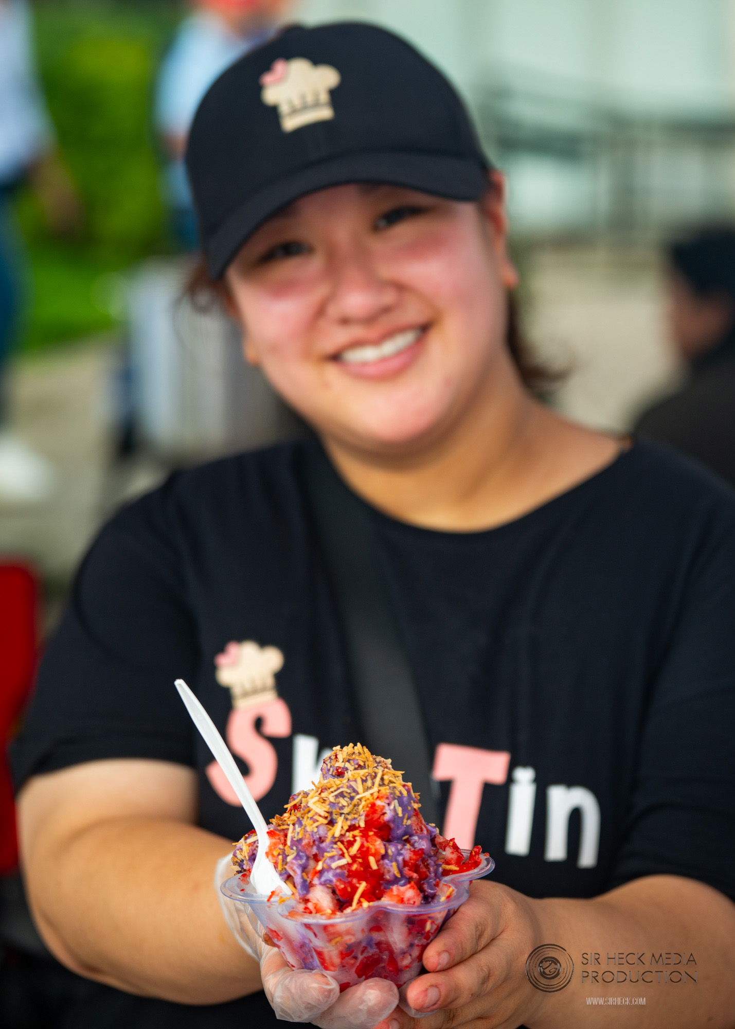Festival attendees enjoying authentic street snacks
